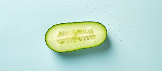 Poster - Closeup of a fresh cucumber on a isolated pastel background Copy space