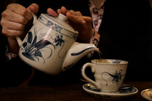 Classic Japanese Pouring Tea From Pot To Cup In A Dark Atmosphere Tea Room