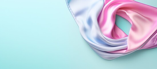 Leinwandbilder - Beautifully patterned silk headscarf isolated on a isolated pastel background Copy space Top view flat lay copy space