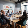 © Abstract Designs - diverse group of people sitting in conference room while discussing about charts shown on a presentation