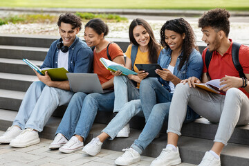 Wall Mural - Learning Concept. Group Of Multiehtnic Students Study Outdoors On Stairs At Campus