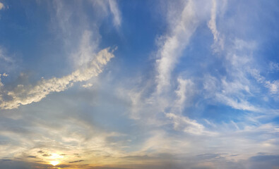 Wall Mural - cloudy sky. white cloud, blue sky and yellow sunlight, sunset nature background