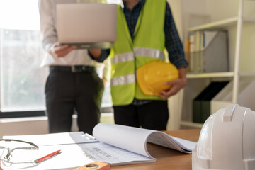 Wall Mural - Engineers team and owner discuss check and review the laptop of construction. Contractor inspection drawing before start project civil. project planning, consulting, architecture.