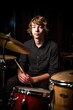© OMD - a handsome young musician sitting behind his drum kit