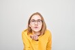 © amixstudio - Portrait of young student girl sending air kisses isolated on white studio background
