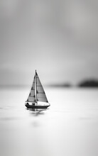 Sailboat On The Sea. Modern Minimalistic Black And White Photography Art Created With Generative Ai Technology.