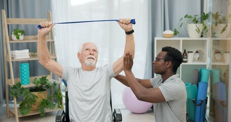 Poster - Man with disability, physiotherapist and stretching band for healthcare rehabilitation, consulting and physical therapy assessment. Clinic, physiotherapy and support for senior patient in wheelchair