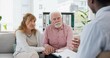 © Nina L/peopleimages.com - Counseling, support and senior couple with therapist in consultation for help, talk or crisis guidance. Therapy, depression and old people holding hands consulting marriage or mental health expert