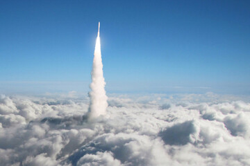 Aufkleber - New space rocket takes off through the clouds into space. Spaceship launch above the clouds. Space mission and science. Rocket, creative idea