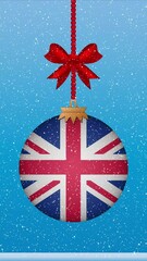 Wall Mural - Snow falling on christmas ball with flag of United Kingdom