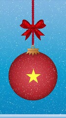 Wall Mural - Snow falling on christmas ball with flag of Vietnam