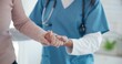 © Nina L/peopleimages.com - Nurse, disabled and old person holding hands for walking support, elderly care or movement disability. Closeup rehabilitation service, retirement home physiotherapy and caregiver help senior patient