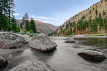 Wide Angle Long Exposure View Of Little Salmon River On Rocky Beach With Mountain Views In Riggins Idaho
