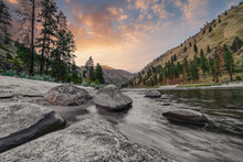 Wide Angle Long Exposure View Of Little Salmon River On Rocky Beach With Mountain Views In Riggins Idaho
