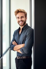 Sticker - shot of a handsome young man smiling while standing in his office