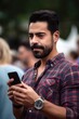 © Alfazet Chronicles - closeup shot of a man checking his cellphone while enjoying drinks at an outdoor event