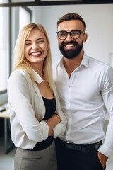 cropped shot of two happy colleagues posing together in the office