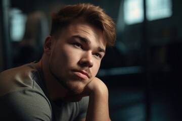 Poster - portrait of a young man taking a break from his workout