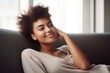 © Alfazet Chronicles - cropped shot of an attractive young woman relaxing on her sofa at home