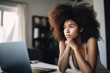 Poster - shot of an attractive young woman using a laptop at home