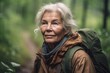 © altitudevisual - portrait of a senior woman hiking in nature
