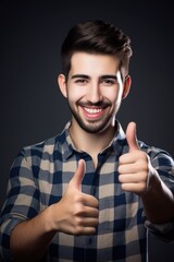 Canvas Print - portrait of a handsome young man making an ok sign