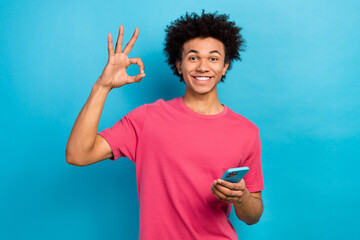 Poster - Photo of cool funky hipster blogger wear trendy pink clothes okey symbol recommendation isolated on blue color background