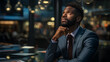 © D-stock photo - Thoughtful african american businessman looking away while sitting in work