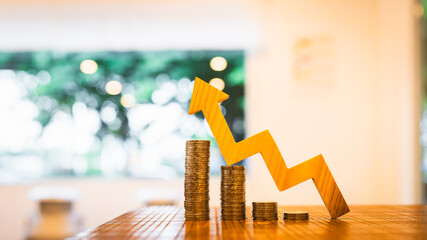 Up Arrow symbol with coins stack. Concepts of the banking system, rising interest rates, inflation, deflation, and savings.