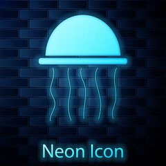 Poster - Glowing neon Jellyfish icon isolated on brick wall background. Vector.