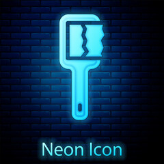 Poster - glowing neon sauna brush icon isolated on brick wall background. wooden brush with coarse bristles f