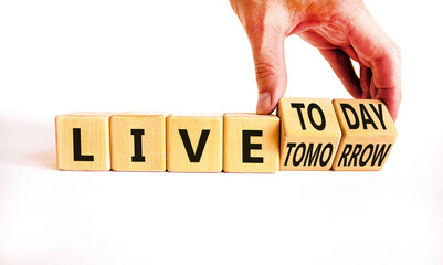 Wall Mural - Live today not tomorrow symbol. Businessman turns wooden cubes and changes word Live tomorrow to Live today. Beautiful white background. Business and live today not tomorrow concept. Copy space.