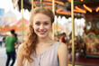 © Jasmina - Smiling young woman having fun in amusement park Prater in Vienna
