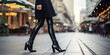 Female legs in black boots, in the street style, creative concept for the new fall collection of stylish women's shoes.