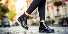 Female Legs In Black Boots, In The Street Style, Creative Concept For The New Fall Collection Of Stylish Women's Shoes.
