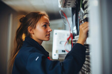 Female Electrician Troubleshooting In A Modern Residence