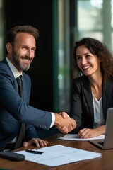 Wall Mural - Happy professional mature Latin businessman and businesswoman wearing suits shake hands sitting at table having partnership business contract agreement. generative AI