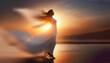 Silhouette d'une femme dansant au soleil couchant.