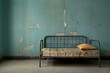 Worn room with faded blue paint, featuring a single gray metal foldable bed. Generative AI