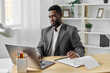 © SHOTPRIME STUDIO - man office student online freelancer african manager american education computer laptop job