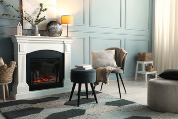 Sticker - Beautiful fireplace, different decor and armchair in living room. Interior design