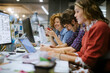 © Geber86 - Diverse group of coworkers working together on a project in the office of a startup company