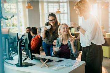 Young and diverse group of women working together in a startup company office