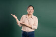 © 1112000 - Gangang middle-aged Asian female portrait posing on blue background