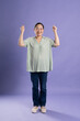 © 1112000 - Gangang middle-aged Asian female portrait posing on purple background