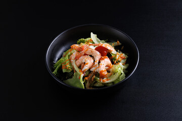 Wall Mural - Japanese salad isolated in black background