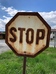 Old rusted stop sign out in the country