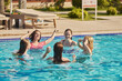 © Westend61 - Happy friends having fun together in pool