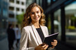 © photobuay - Confident and Successful Young Business Woman Smiles with Assurance While Holding a Tablet, Exemplifying Professional Competence. created with Generative AI