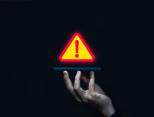 Wall Mural - businessman using laptop showing warning triangle and exclamation sign icon warning of dangerous pro